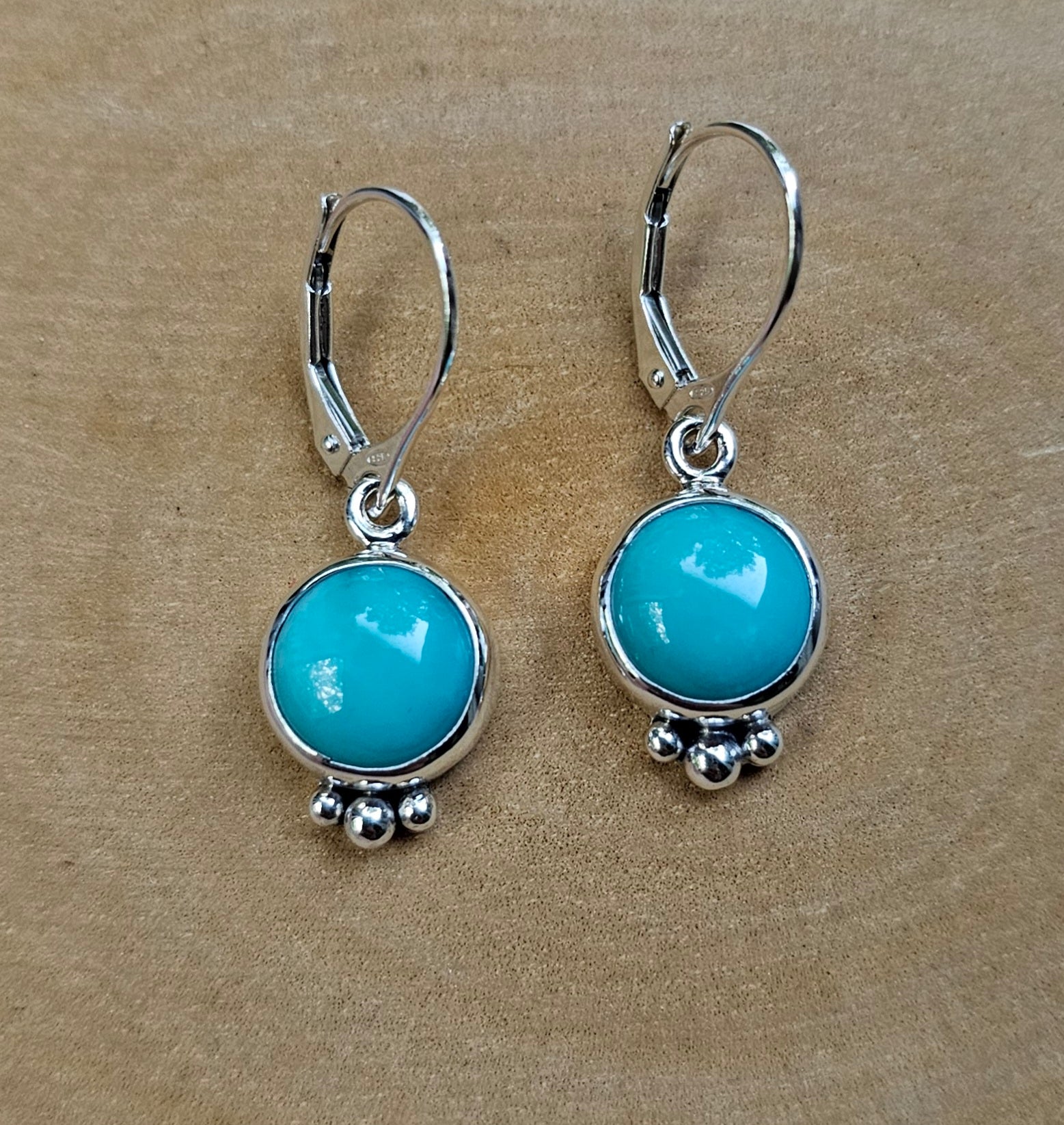 Round turquoise and sterling silver dangle earrings with silver beaded accents