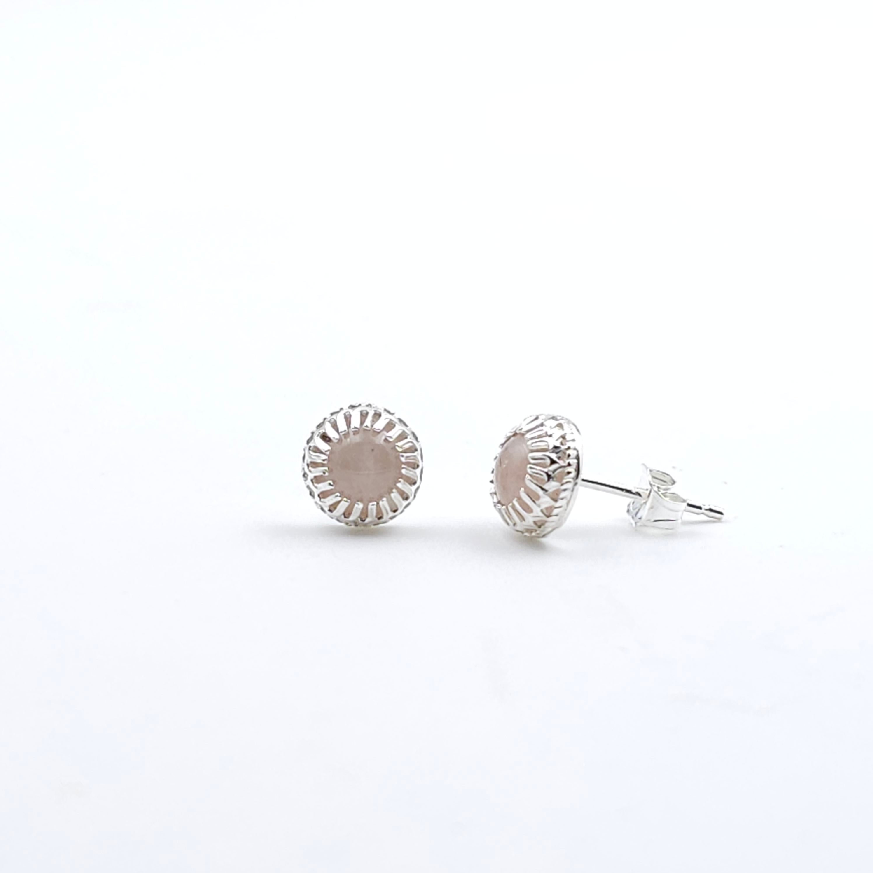 Light pink rose quartz post earrings in sterling silver crown bezel setting.