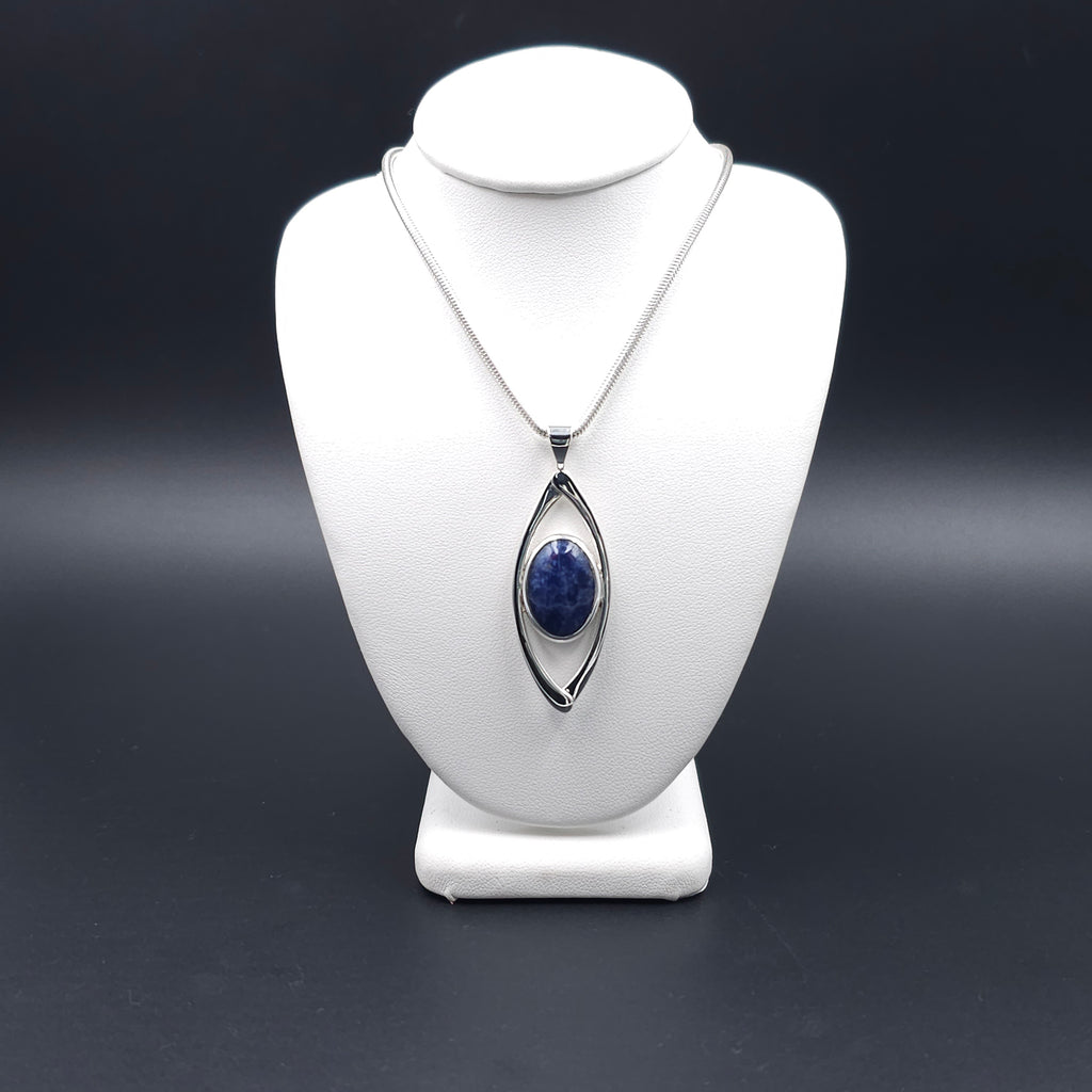 Marquis shaped open silver pendant with bezel set blue sodalite gem inside