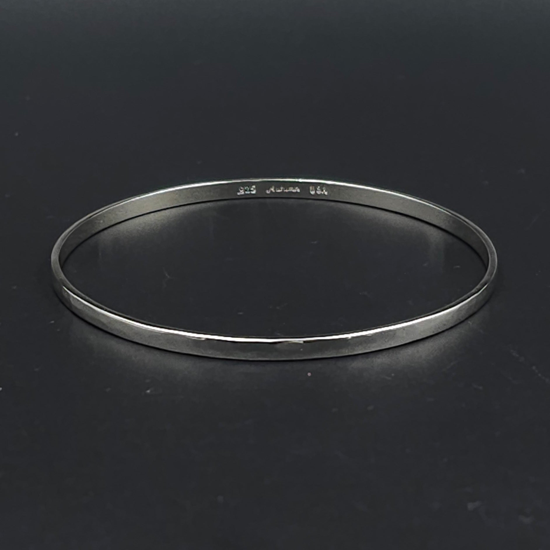 Slightly hammered sterling silver bangle bracelet