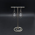 Sterling silver pointed teardrop earrings with white sea glass