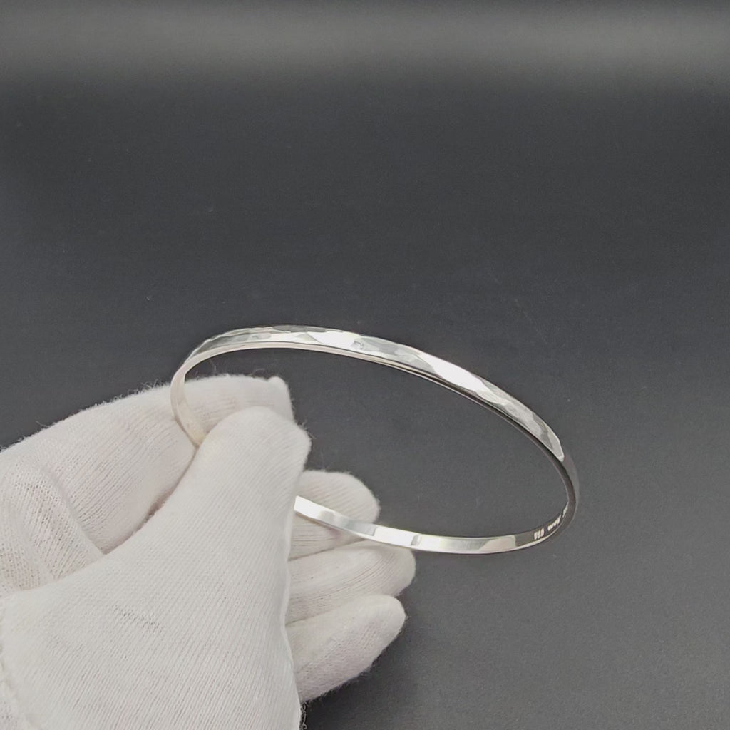 Slightly hammered sterling silver bangle bracelet