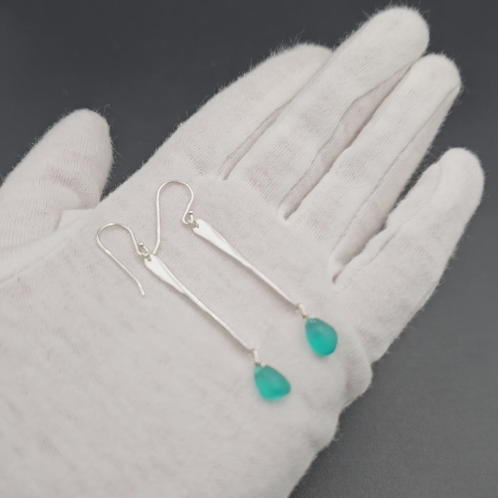 Long hammered dangle earrings with teal sea glass