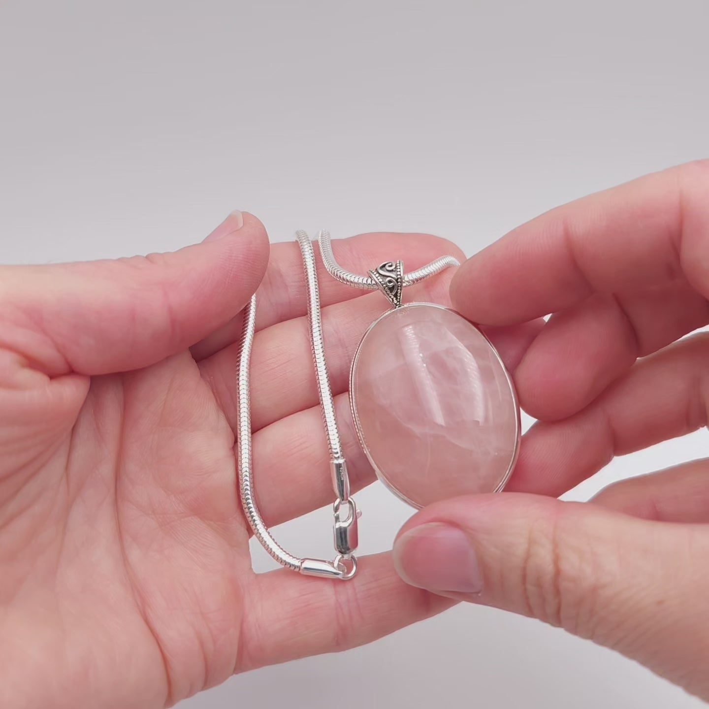 Large oval rose quartz bezel set sterling silver necklace