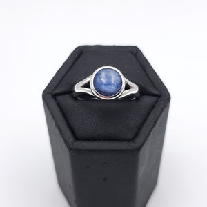 Sterling silver ring with bezel set round blue kyanite gemstone
