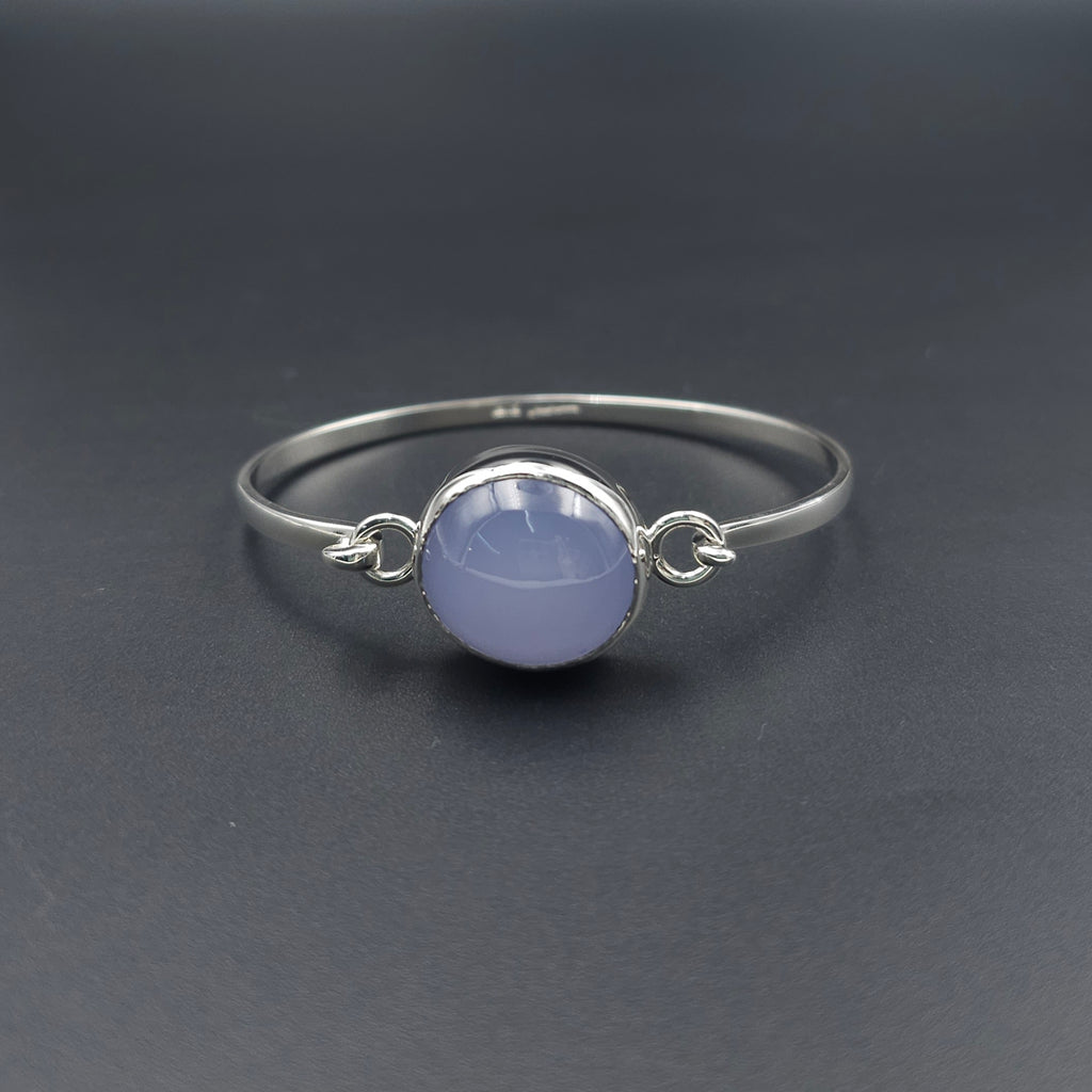 Silver hook on bracelet with light purple oval bezel set Chalcedony gemstone in center