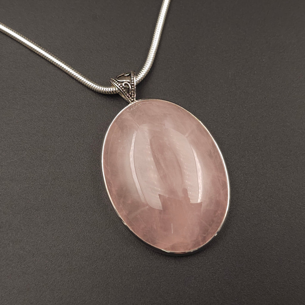 Large oval rose quartz bezel set sterling silver necklace