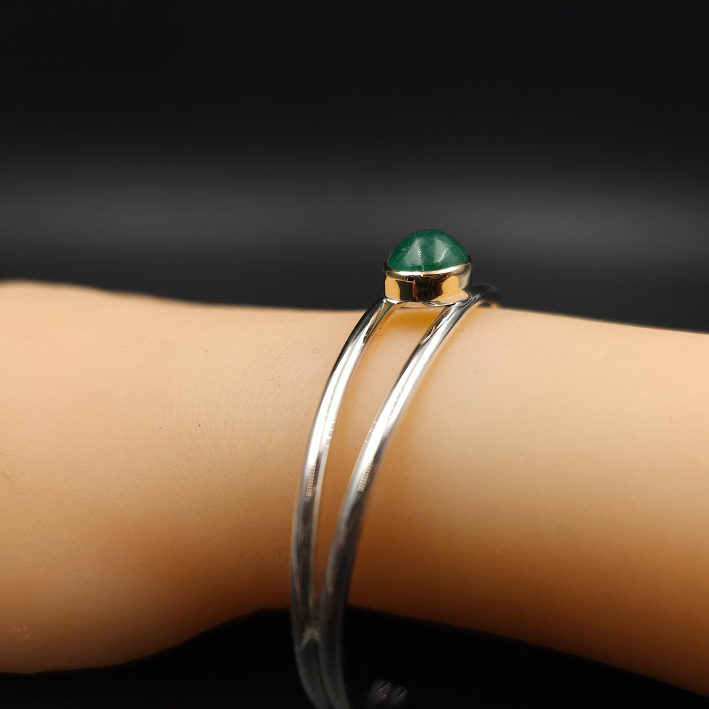 Sterling silver emerald cuff bracelet with 18k gold bezel