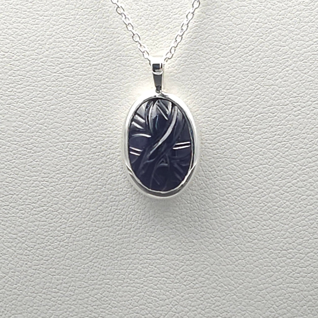 Carved iolite bezel set sterling silver necklace
