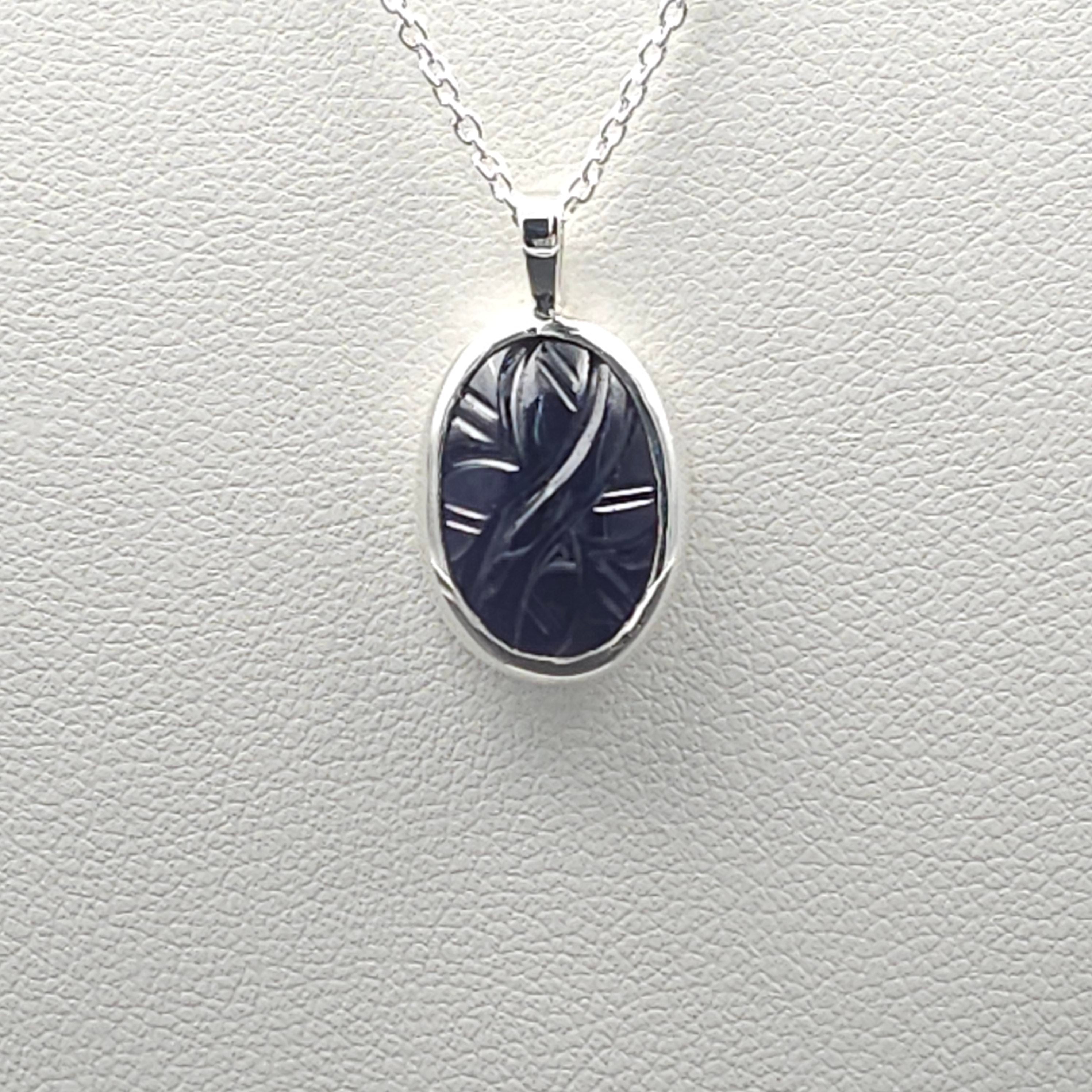 Carved iolite bezel set sterling silver necklace