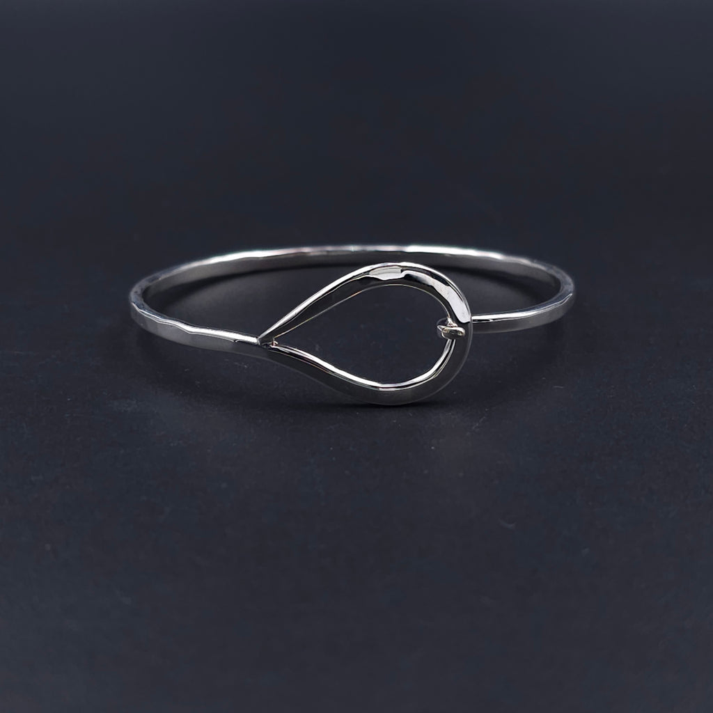 Silver teardrop hook on bracelet