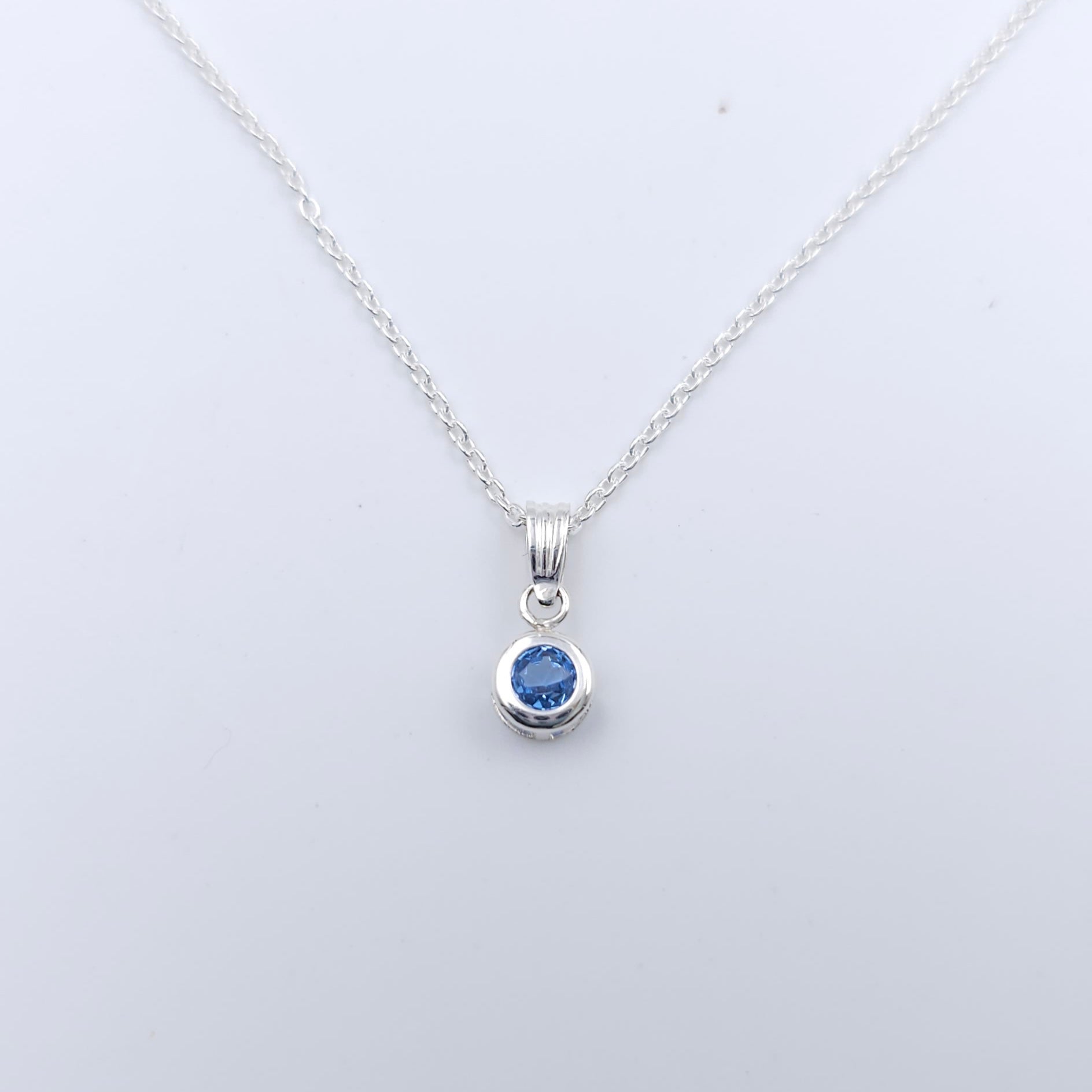 Lab grown blue zircon bezel set sterling silver necklace