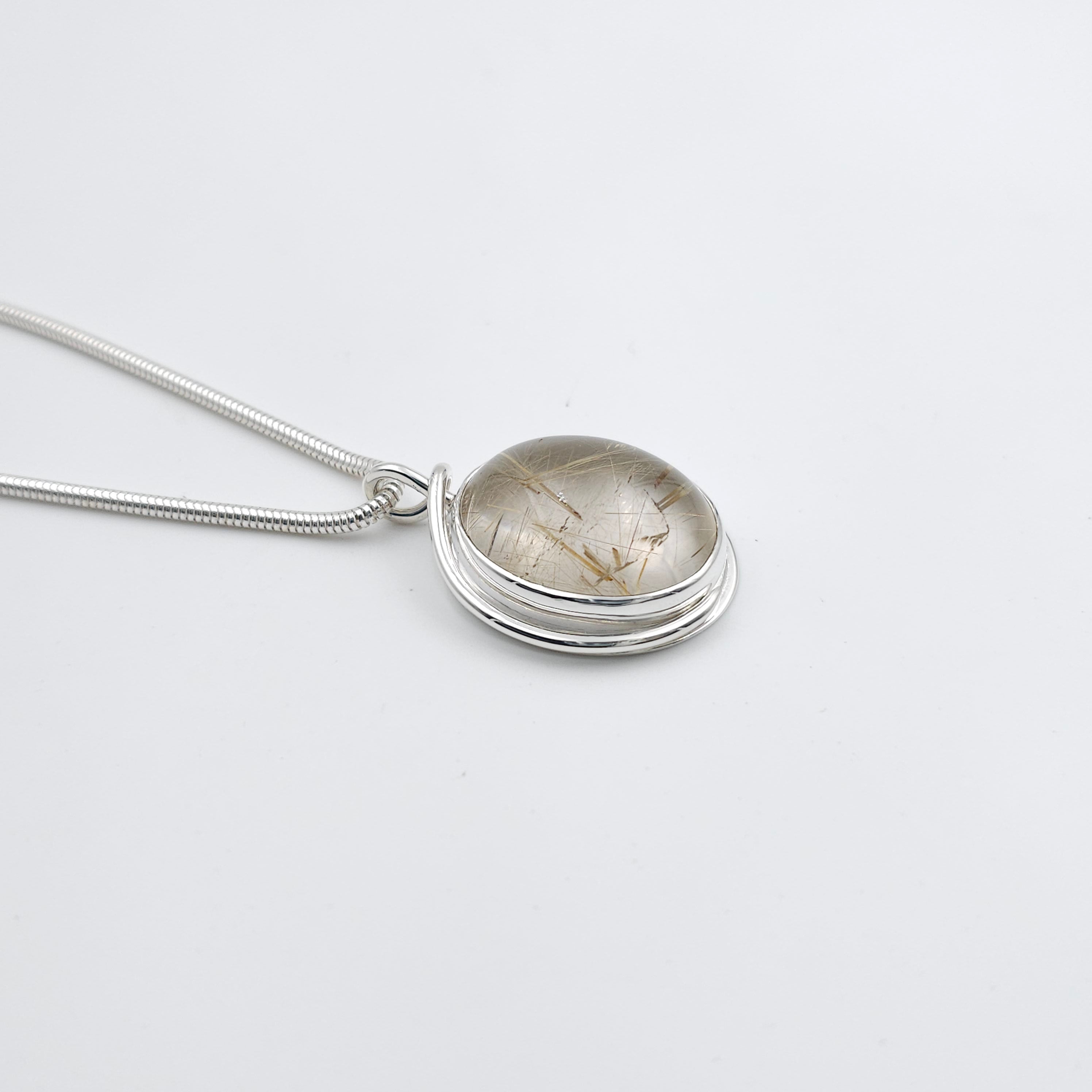 Rutilated quartz bezel set sterling silver necklace