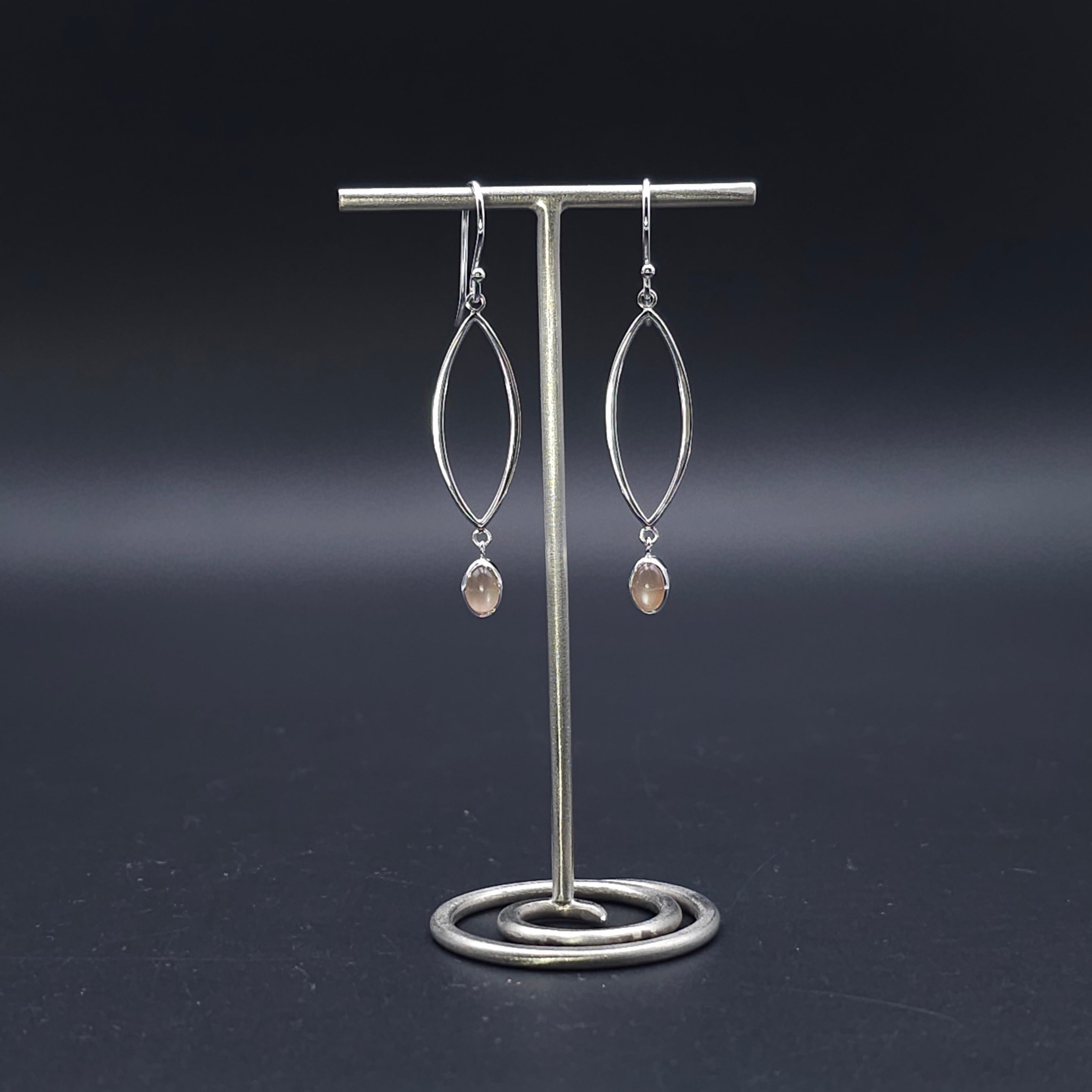 Sterling silver marquise shaped earrings with peach moonstone dangles