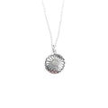 A silver stamped daisy round pendant necklace on a delicate silver chain
