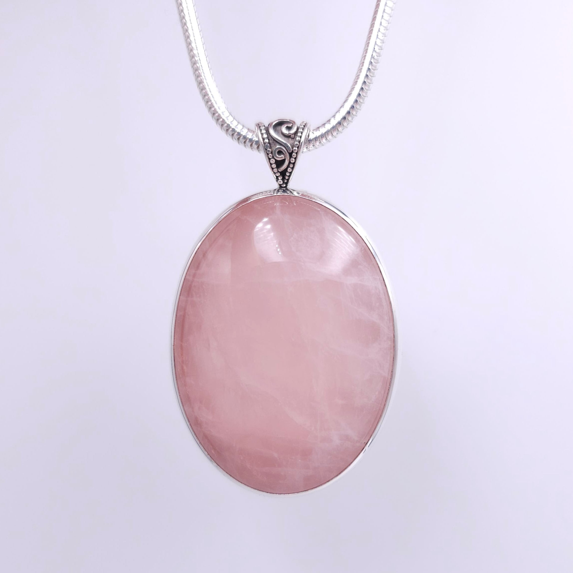 Large oval rose quartz bezel set sterling silver necklace