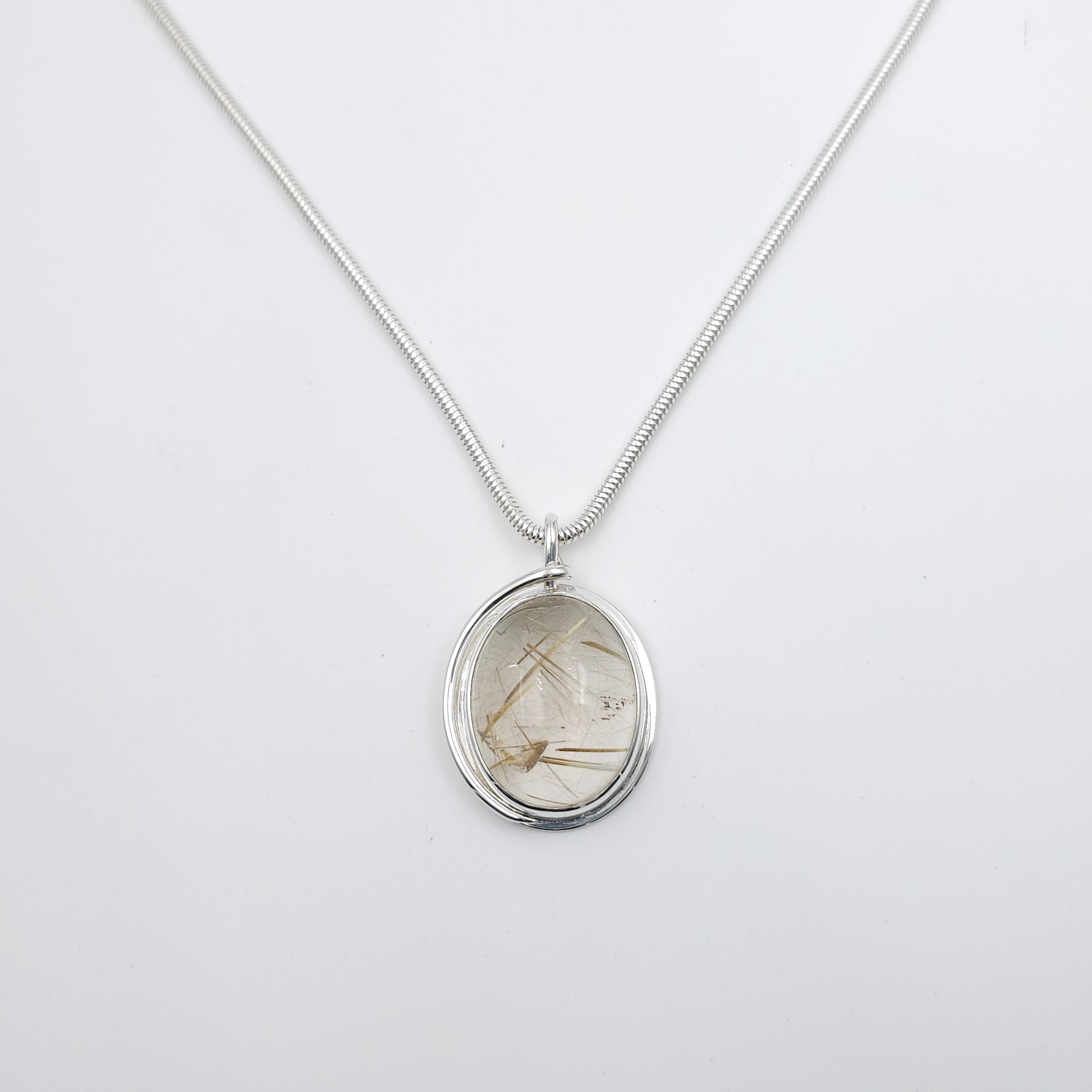Rutilated quartz bezel set sterling silver necklace