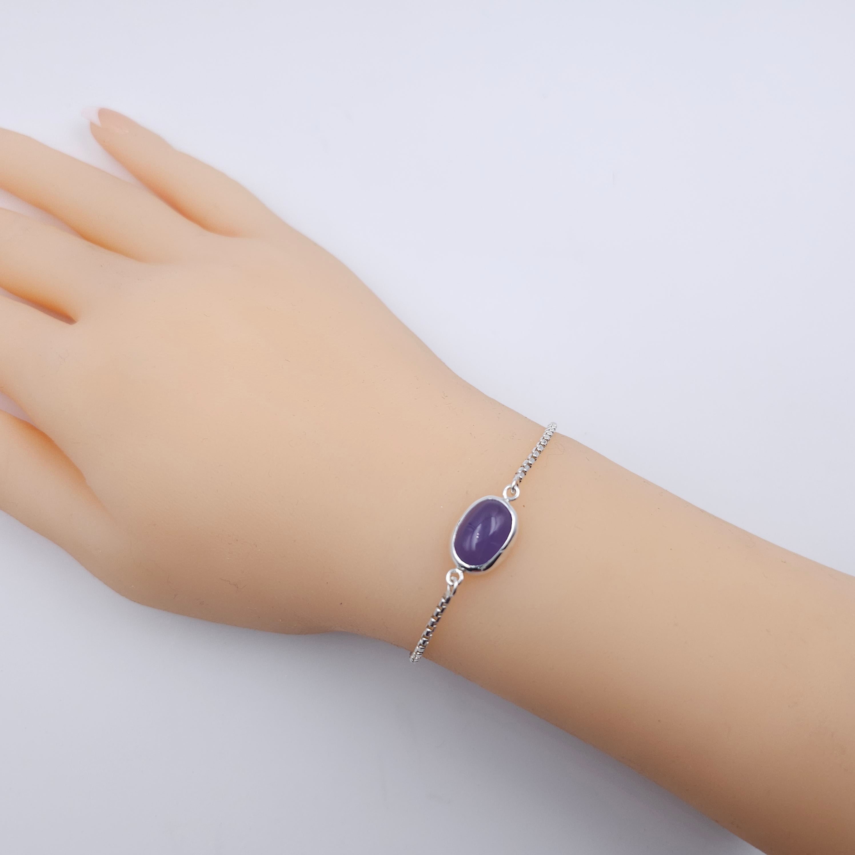 Silver adjustable chain bracelet with bezel set purple Chalcedony gemstone