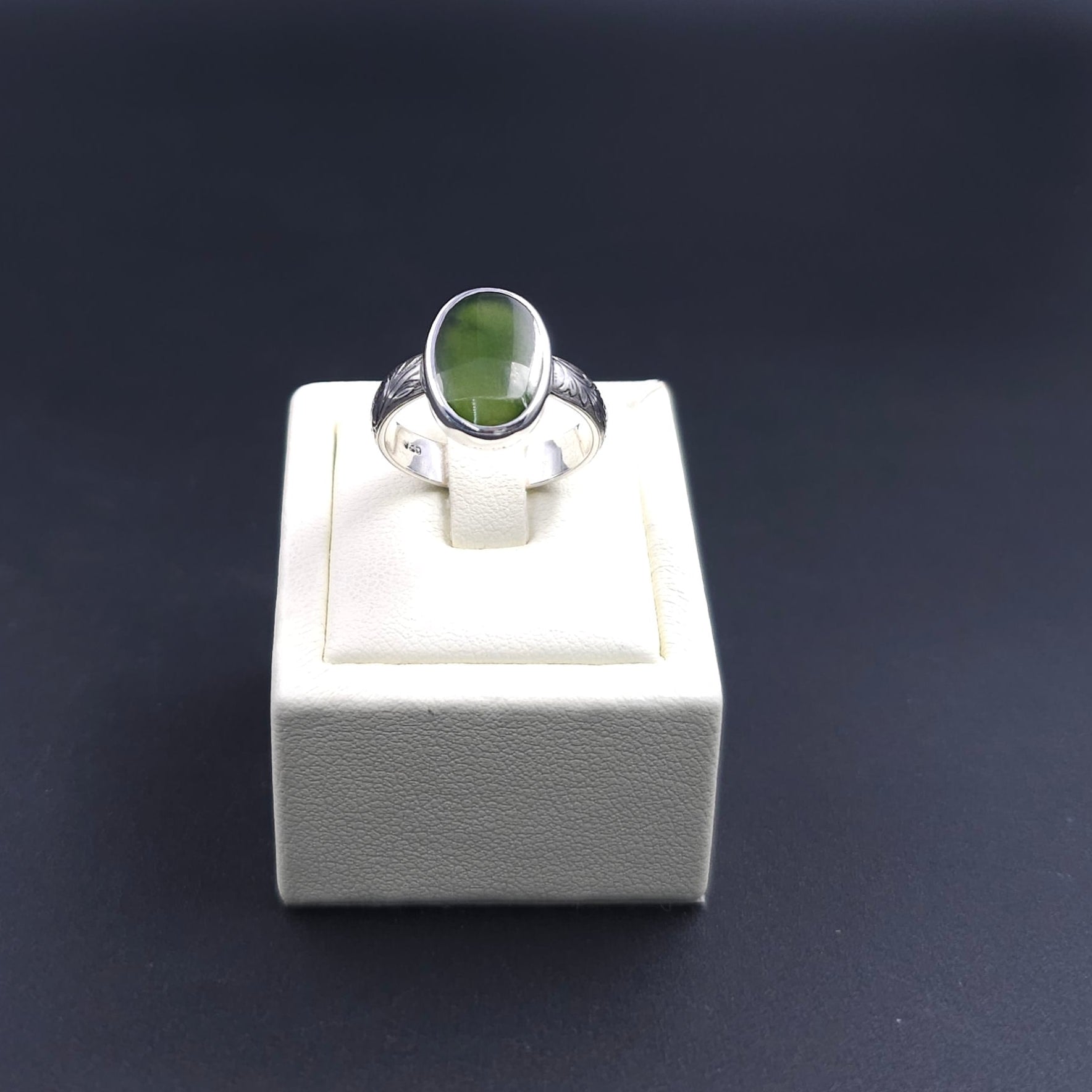 Floral silver band with bezel set oval green Jade gemstone