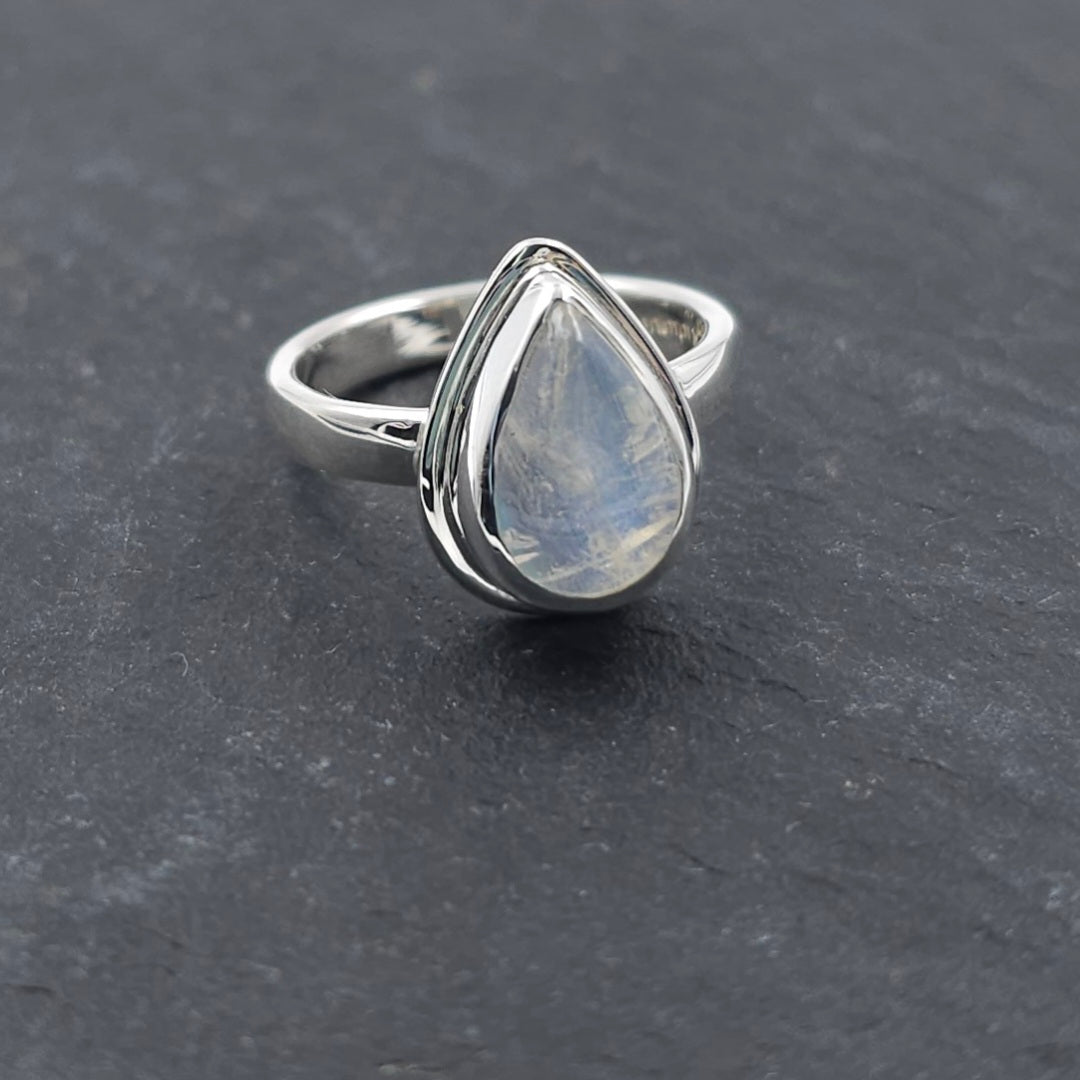 Rainbow moonstone teardrop bezel set sterling silver ring