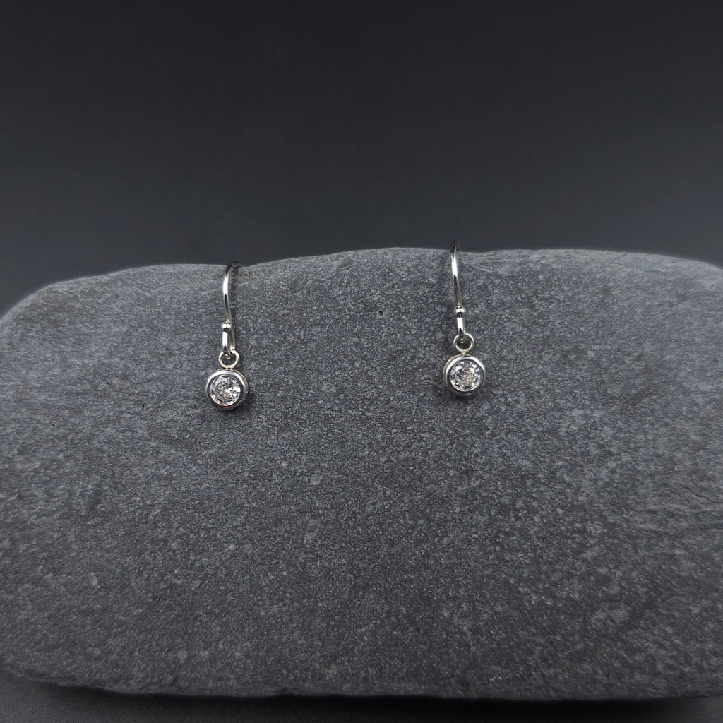 Cubic zirconia bezel set small round dangle earrings on silver french earring wires