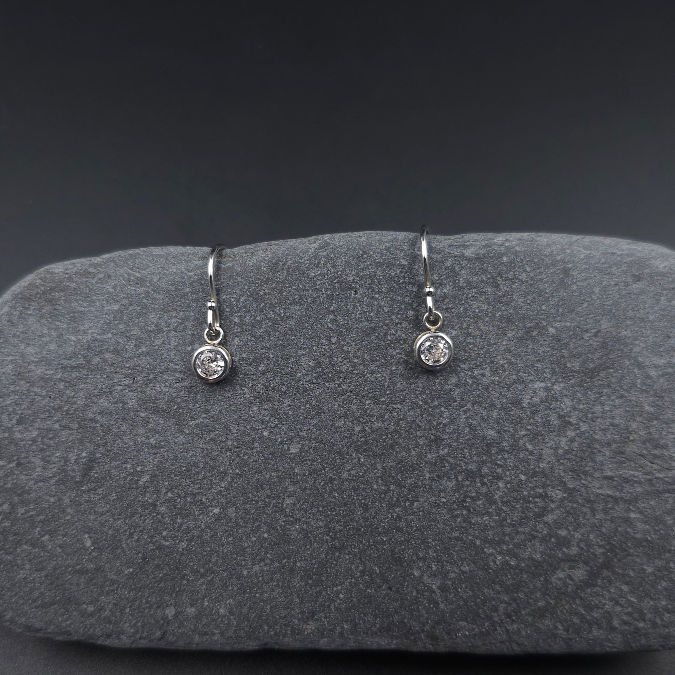Cubic zirconia bezel set small round dangle earrings on silver french earring wires