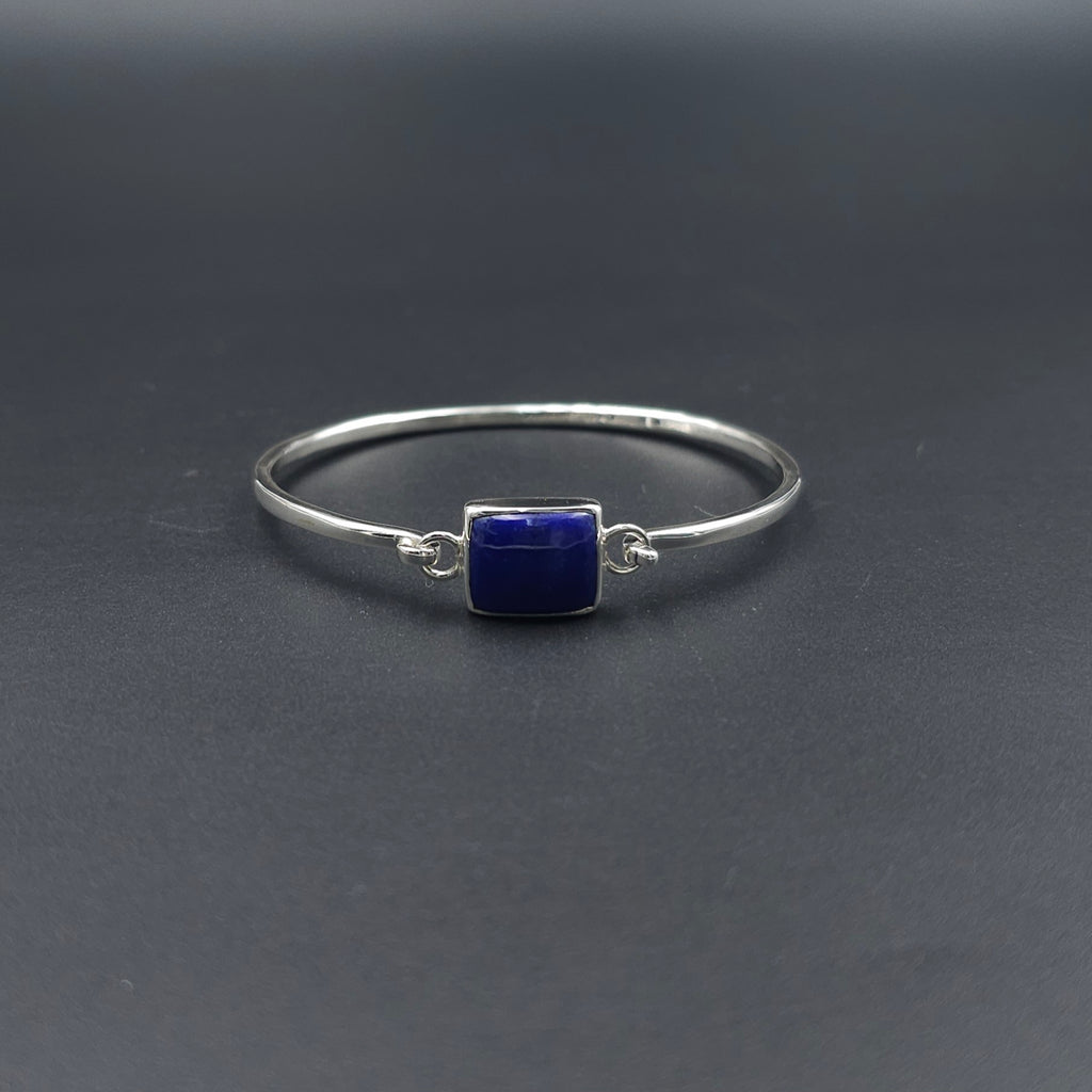 Oval silver hook on bracelet with rectangle blue lapis lazuli stone bezel set in center