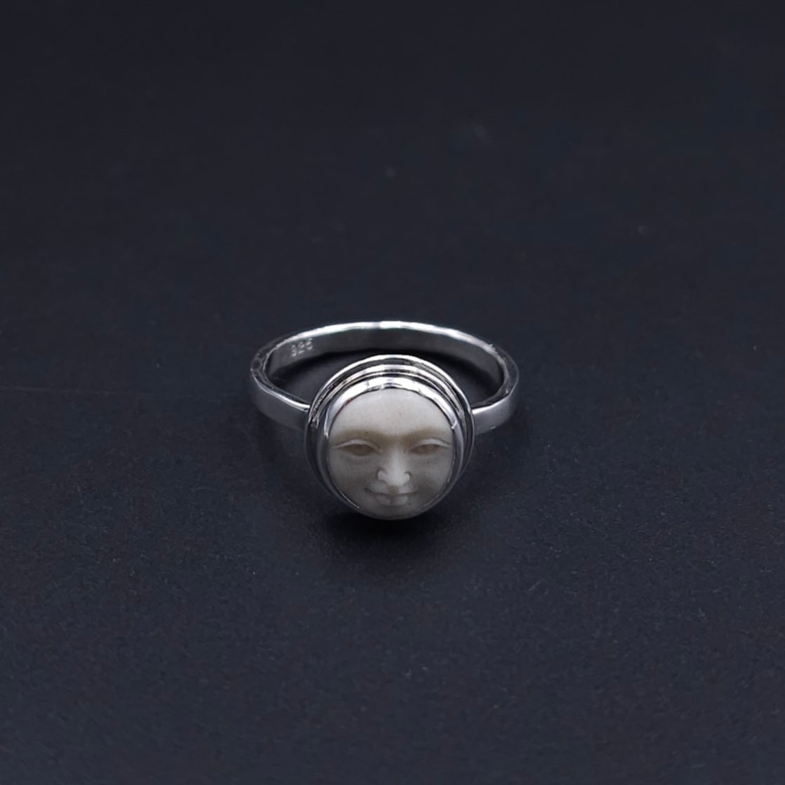 Sterling silver carved face ring