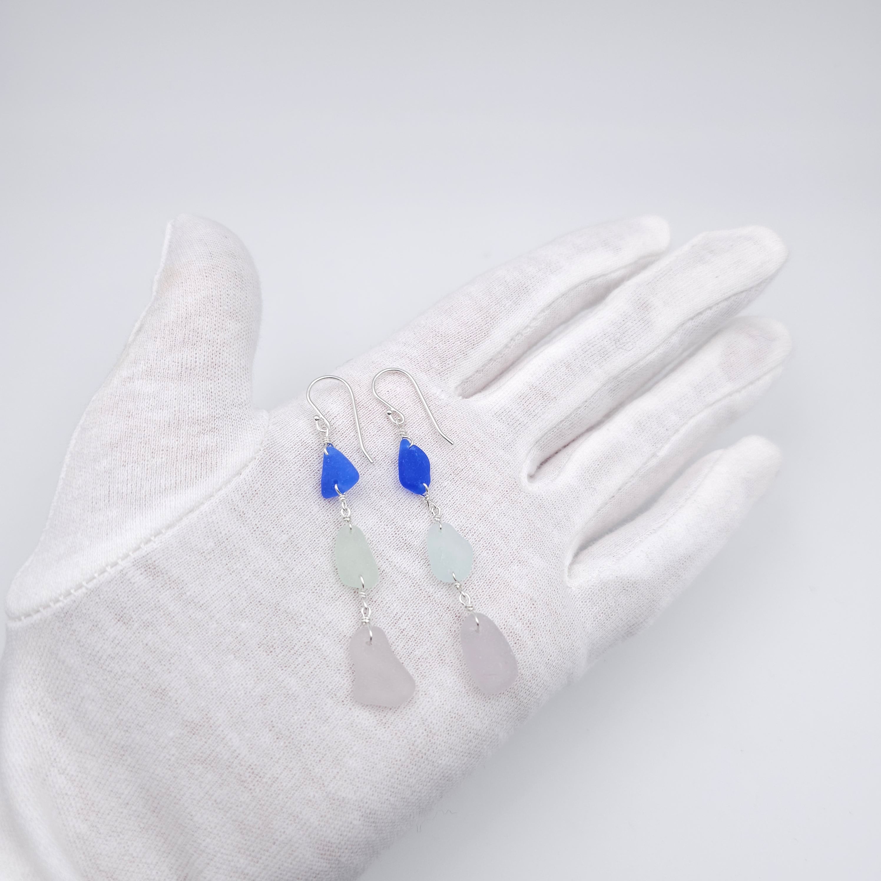 Triple sea glass earrings on hand 