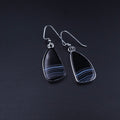 freeform teardrop shaped black onyx stones with white stripes at the bottom bezel set in silver with french earring wires