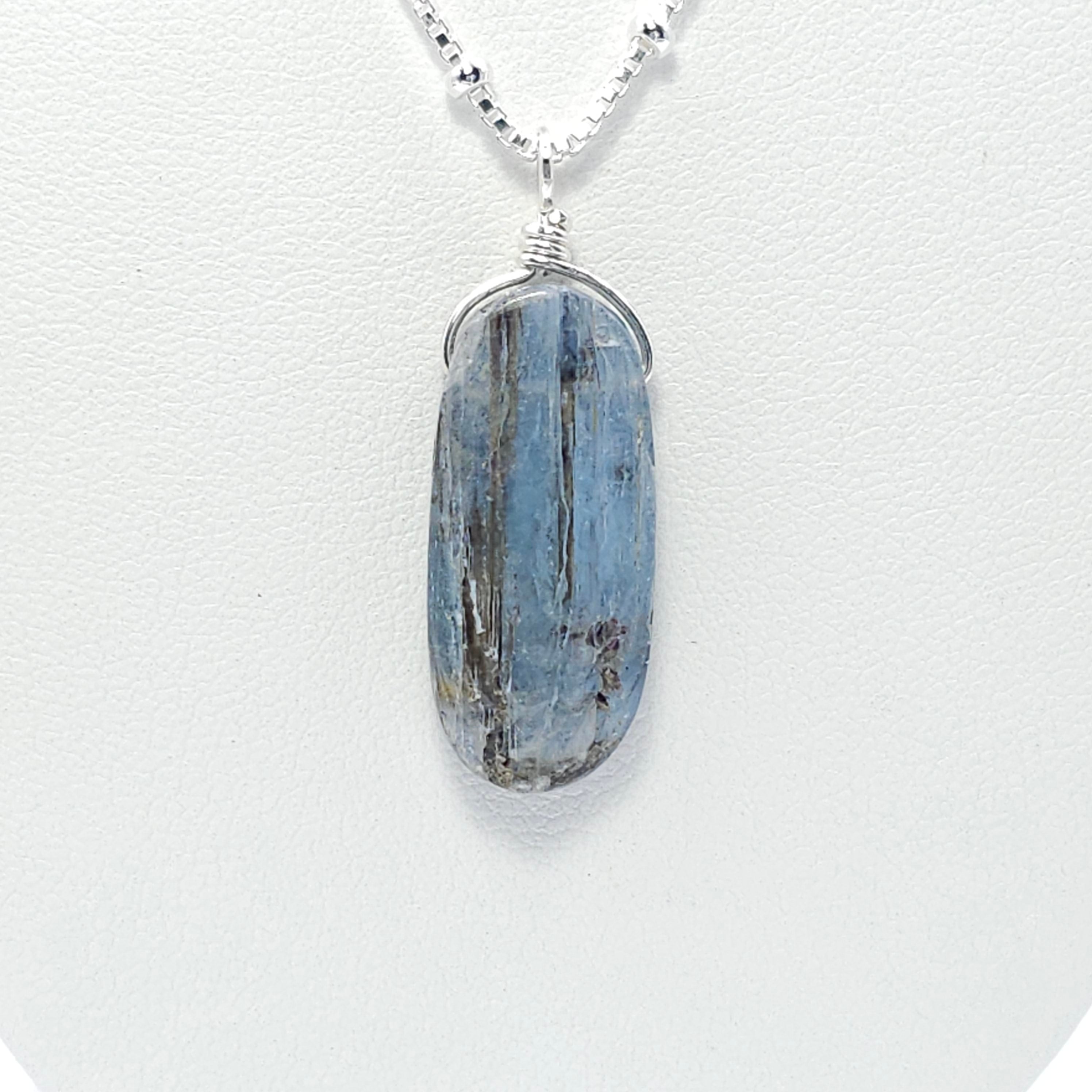 Light blue long oval Kyanite bead pendant with natural black inclusions