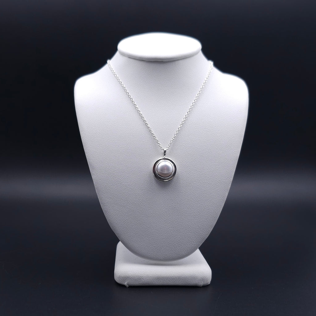 Round pearl necklace bezel set in sterling silver
