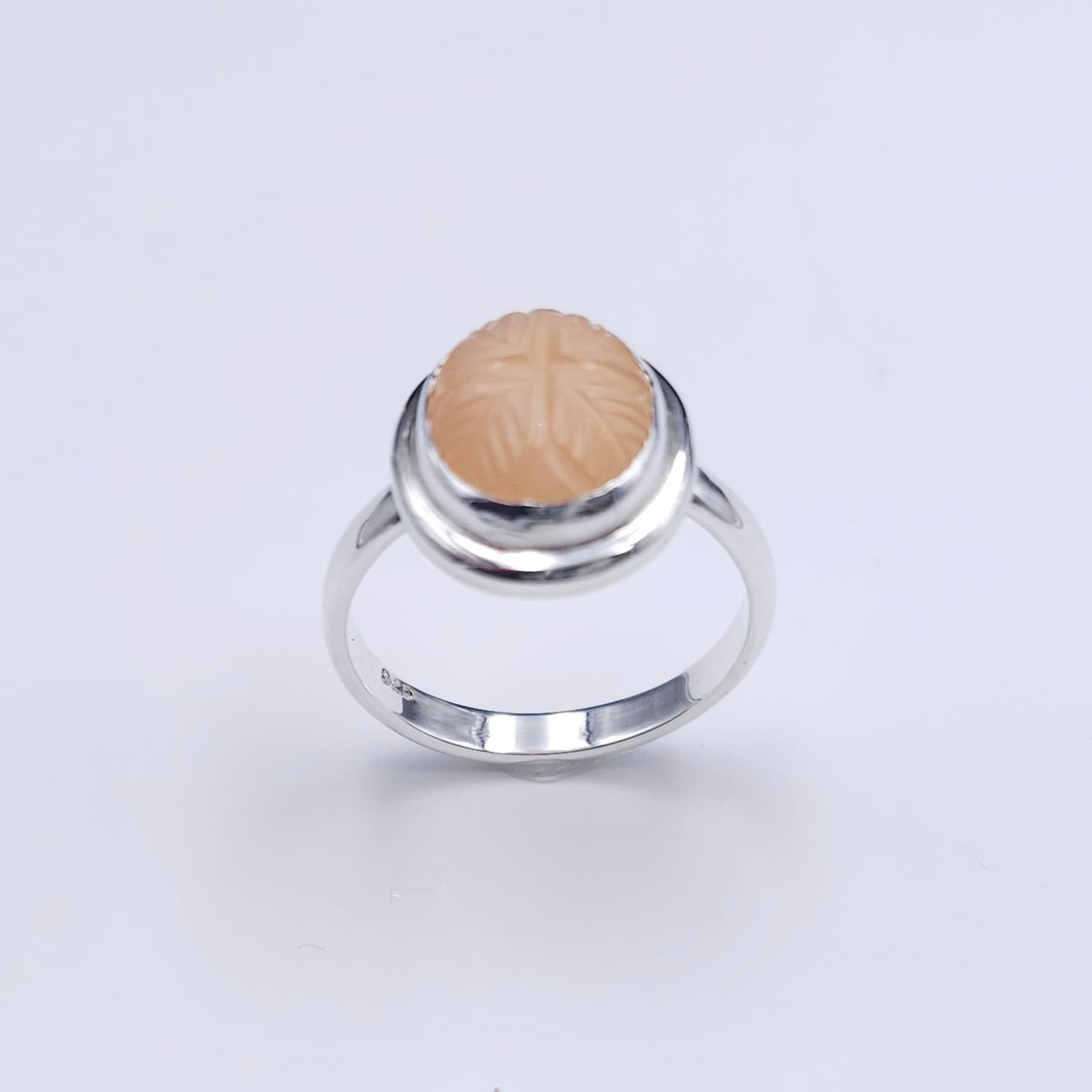 Carved peach moonstone sterling silver ring