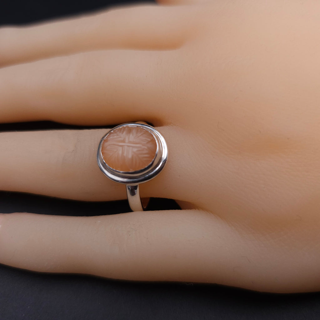 Carved peach moonstone sterling silver ring