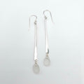 Long hammered dangle earrings with white sea glass