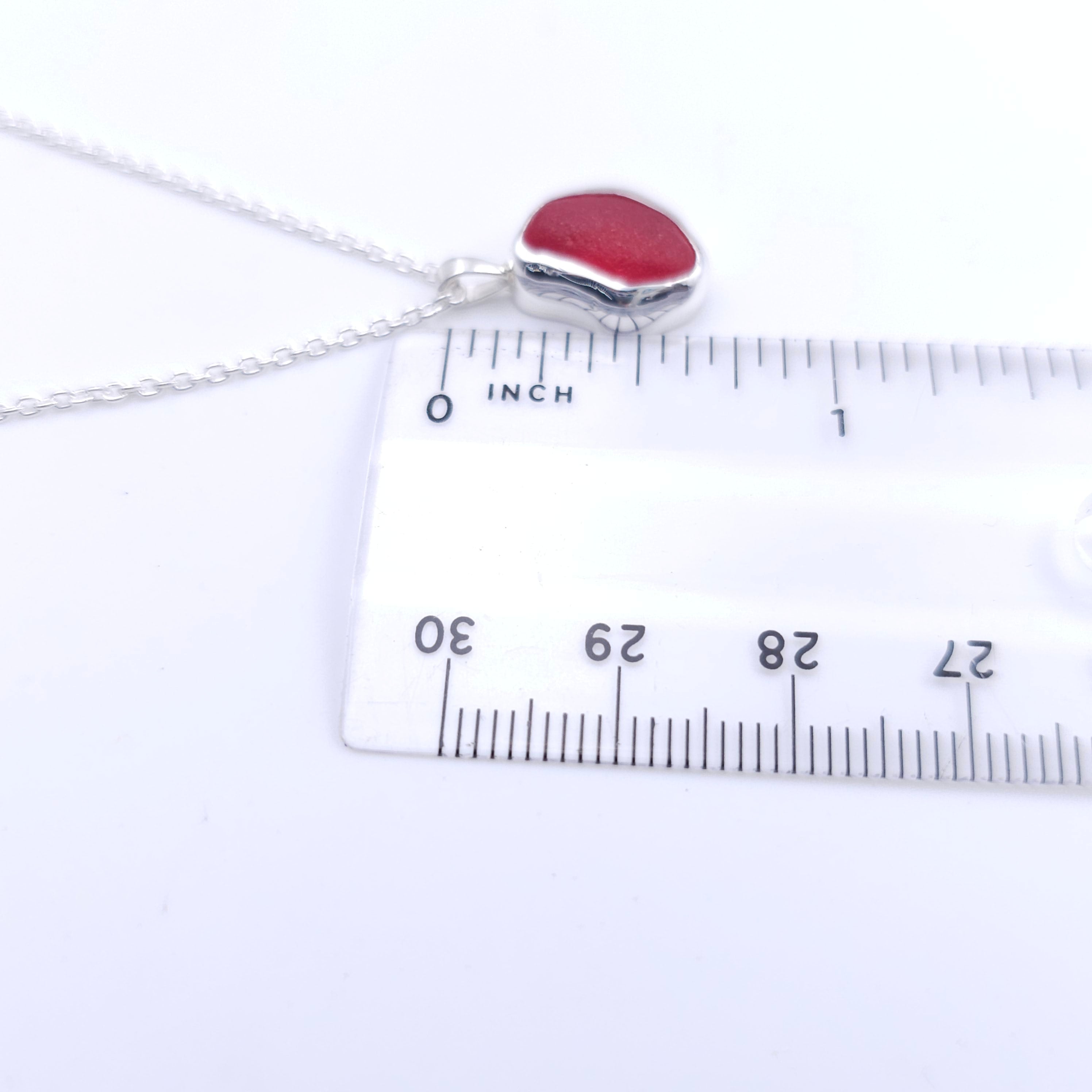 Showing pendant is about 5/8" long
