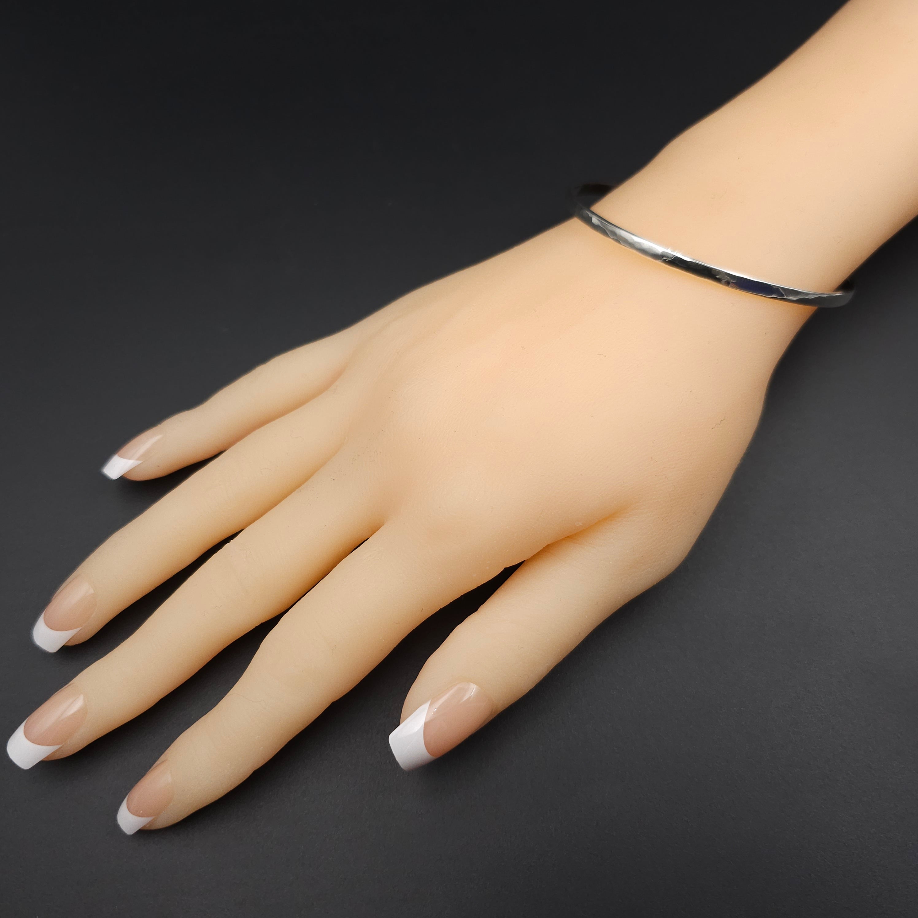 Slightly hammered sterling silver bangle bracelet