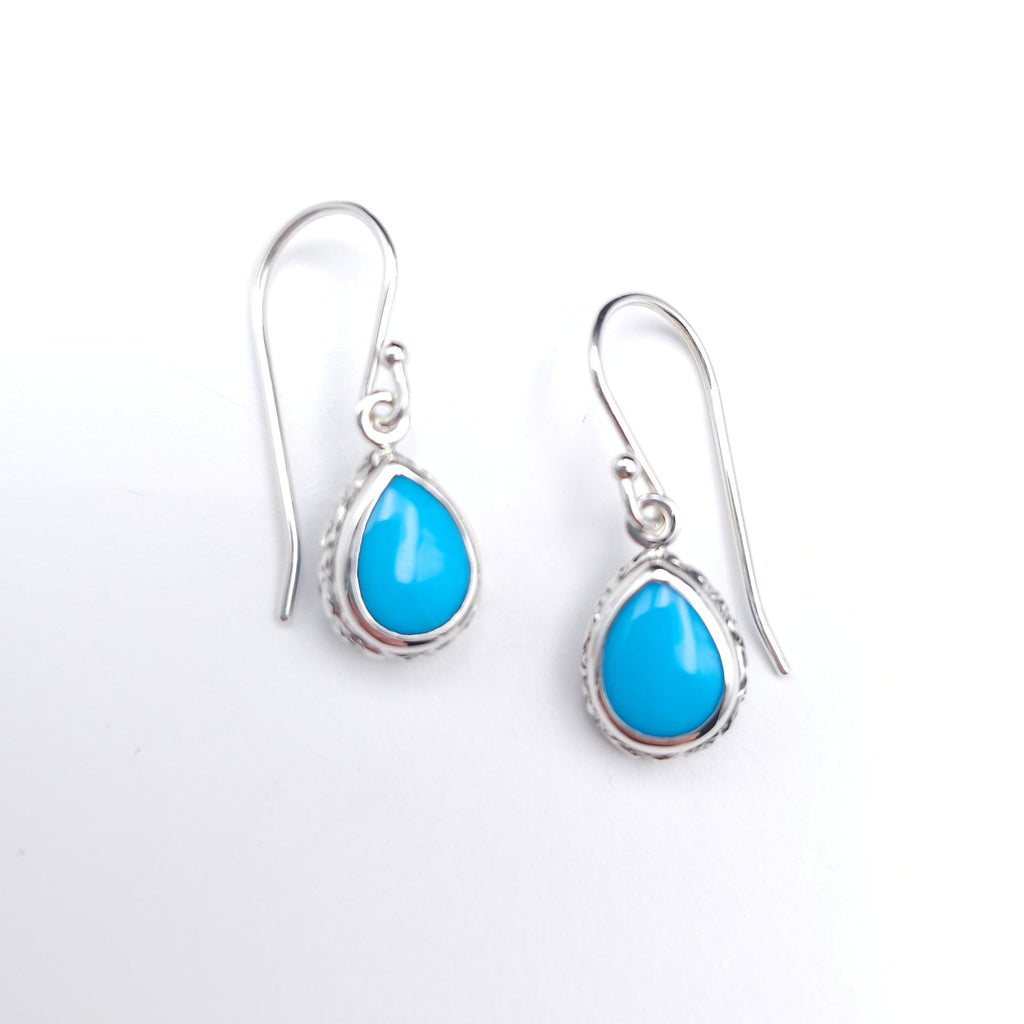 Silver earrings with bezel set teardrop turquoise gemstones