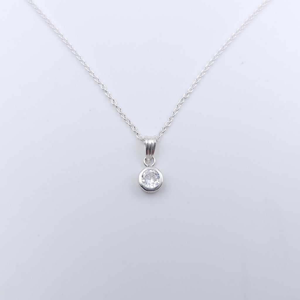 Silver necklace with a round bezel set cubic zirconia pendant 