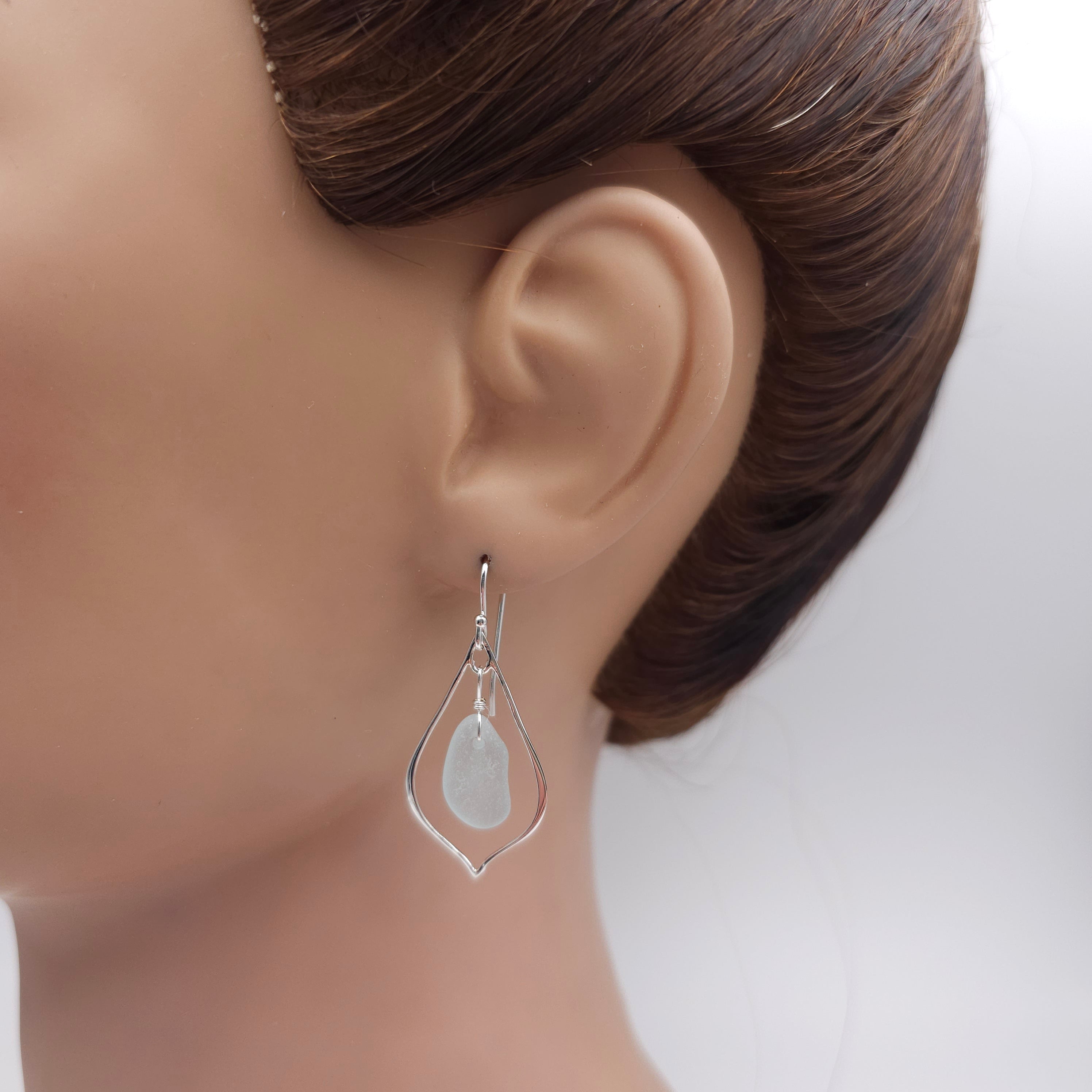 Sterling silver pointed teardrop earrings with light blue sea glass