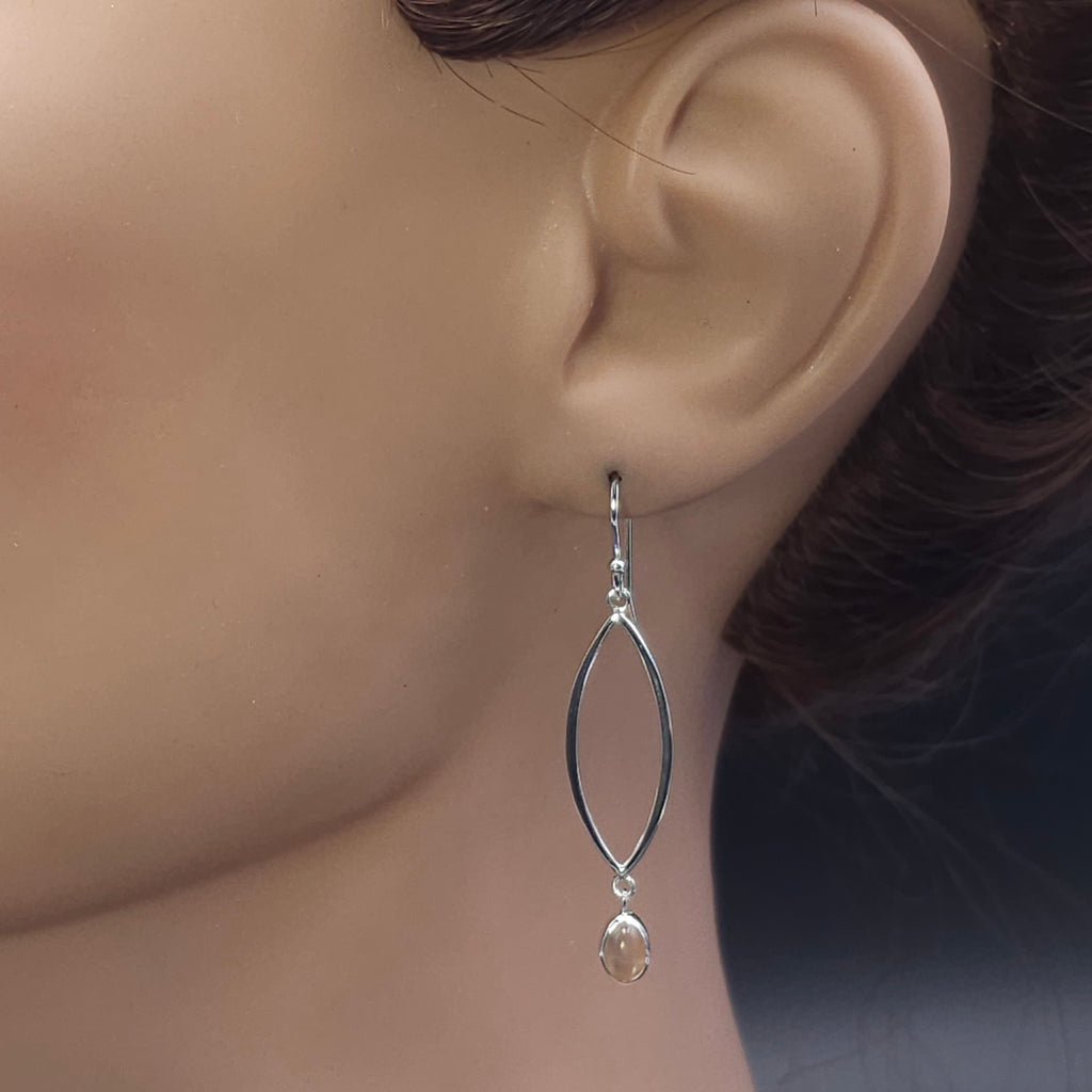 Sterling silver marquise shaped earrings with peach moonstone dangles