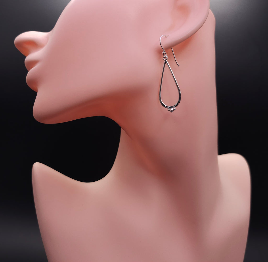 Teardrop sterling silver earrings with silver beaded accents