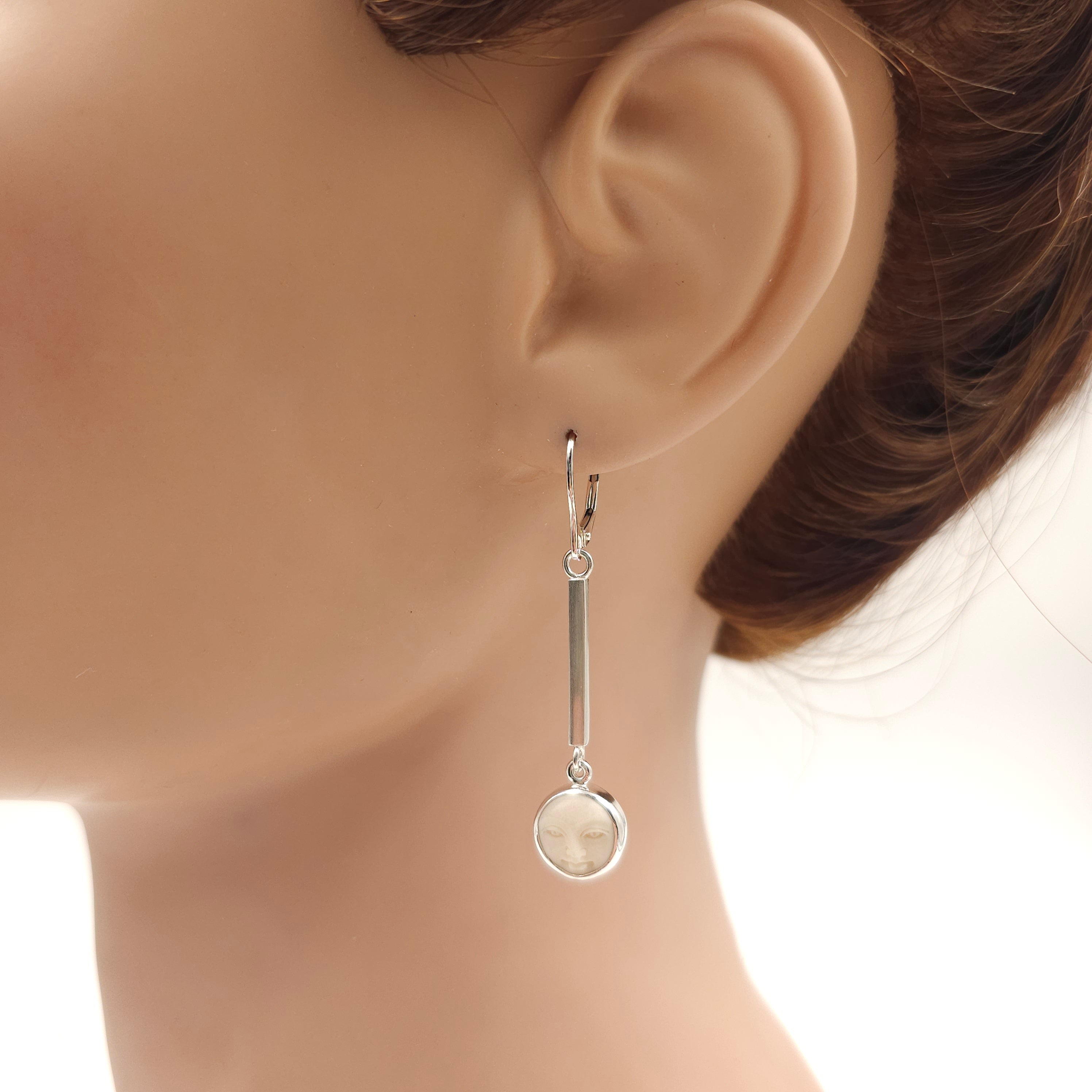 Carved bone face earrings sterling silver