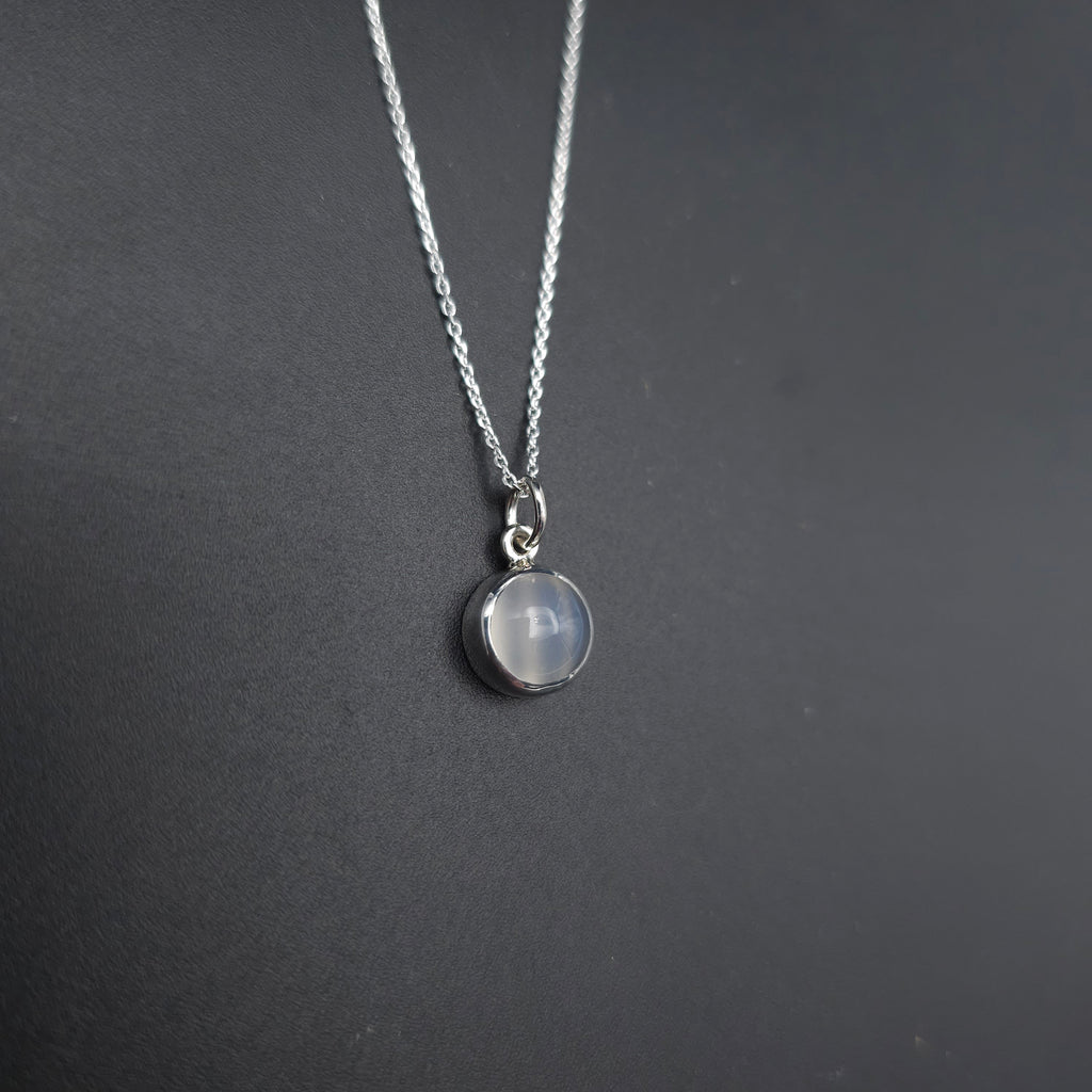 Round moonstone bezel set sterling silver necklace