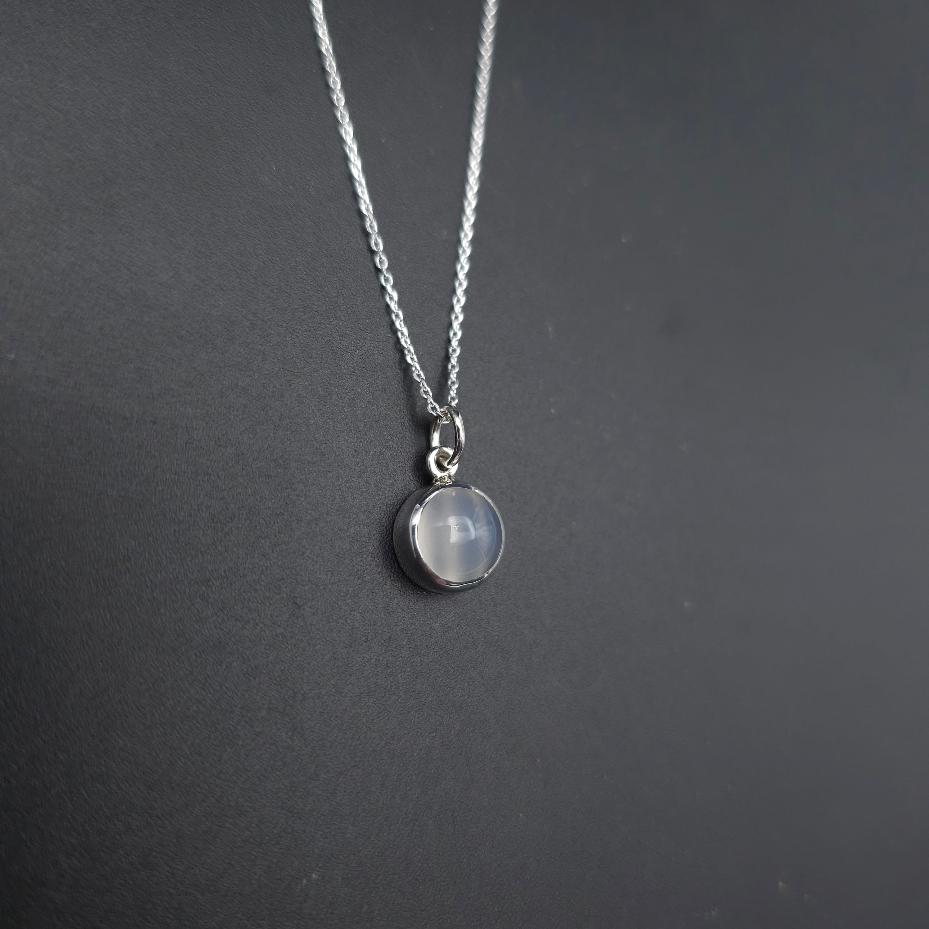 Round moonstone bezel set sterling silver necklace