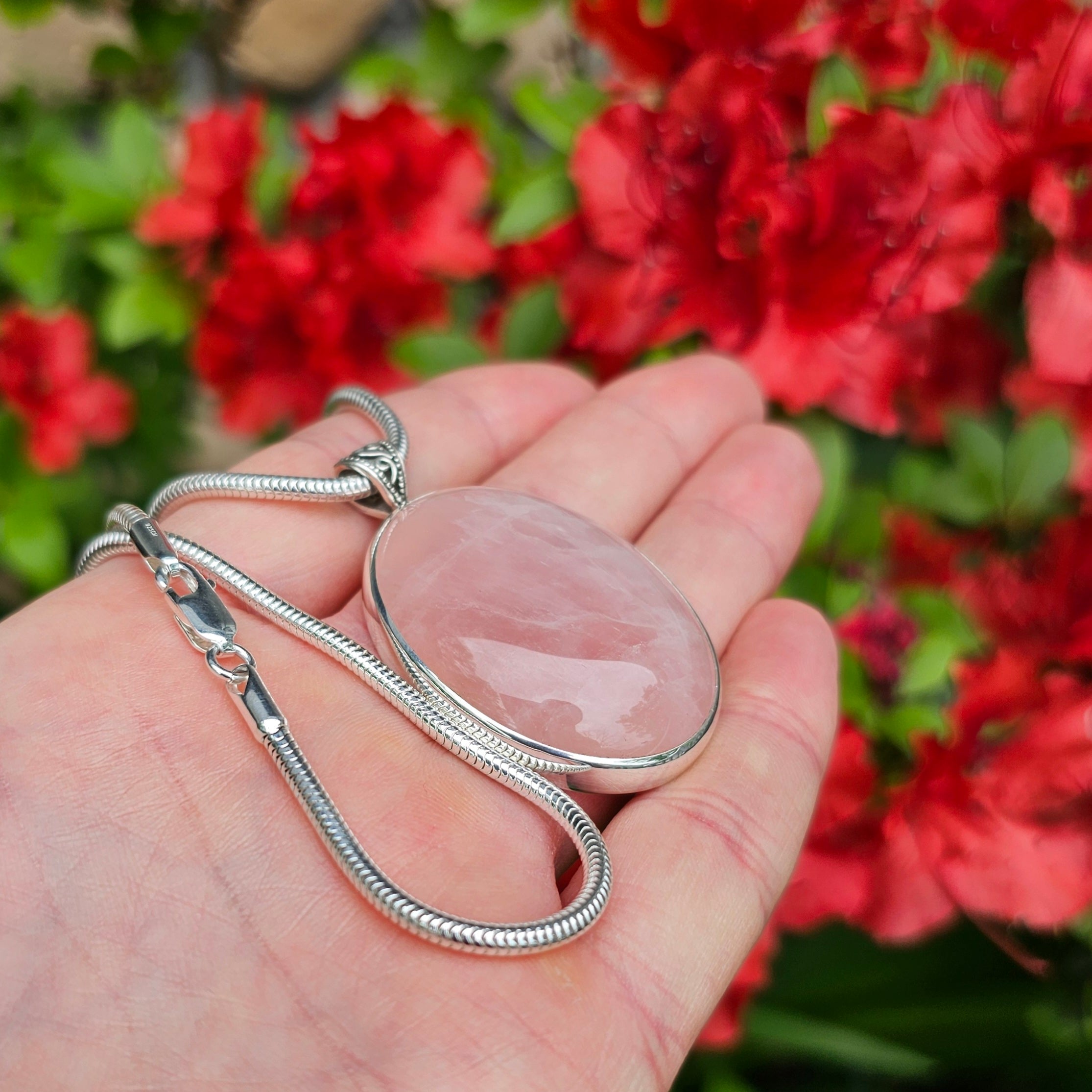 Large oval rose quartz bezel set sterling silver necklace