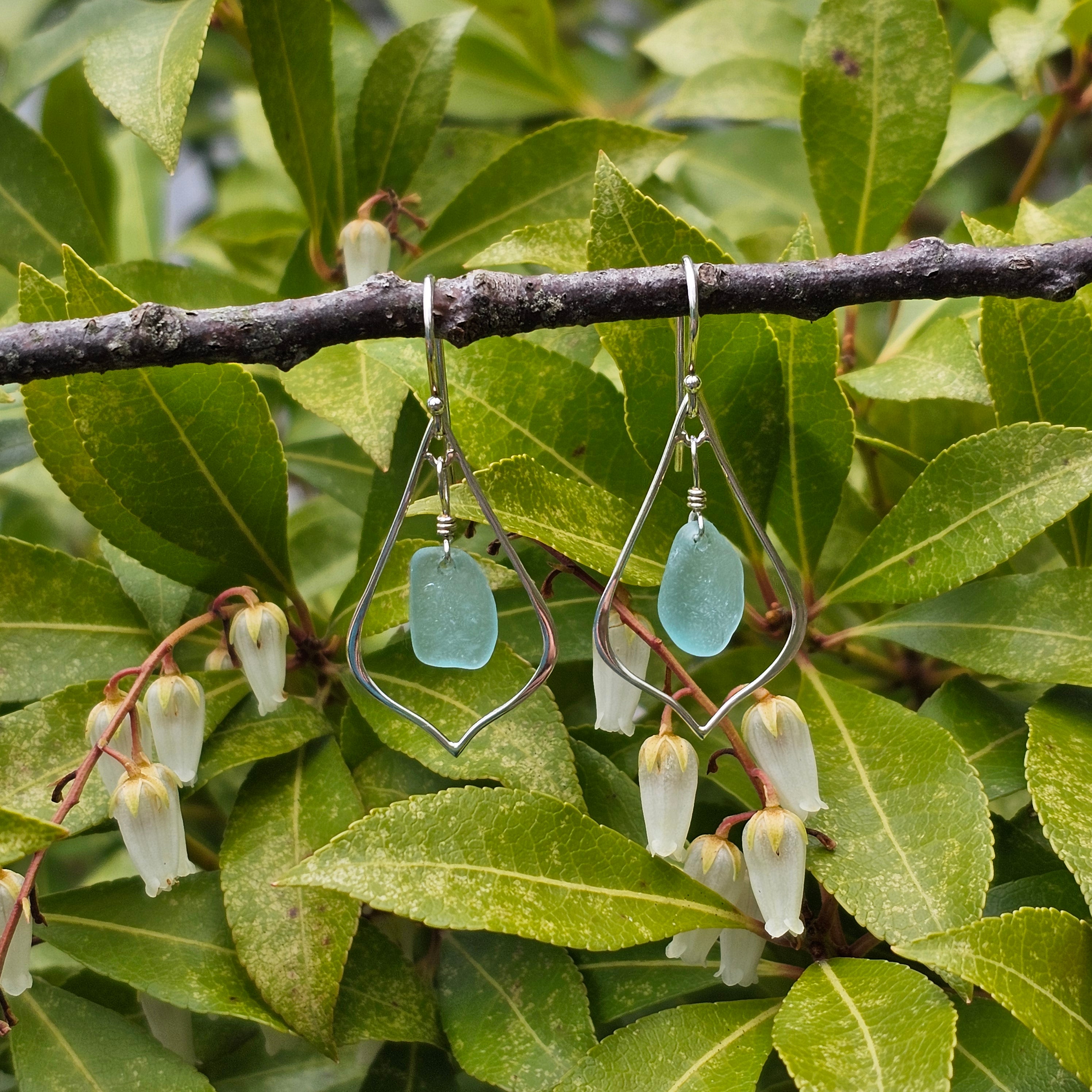 Sterling silver pointed teardrop earrings with light blue sea glass