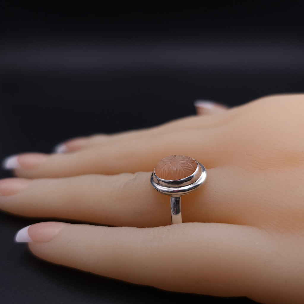 Carved peach moonstone sterling silver ring