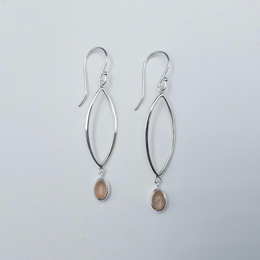 Marquise shaped open silver dangles with small oval peach moonstones dangling below.