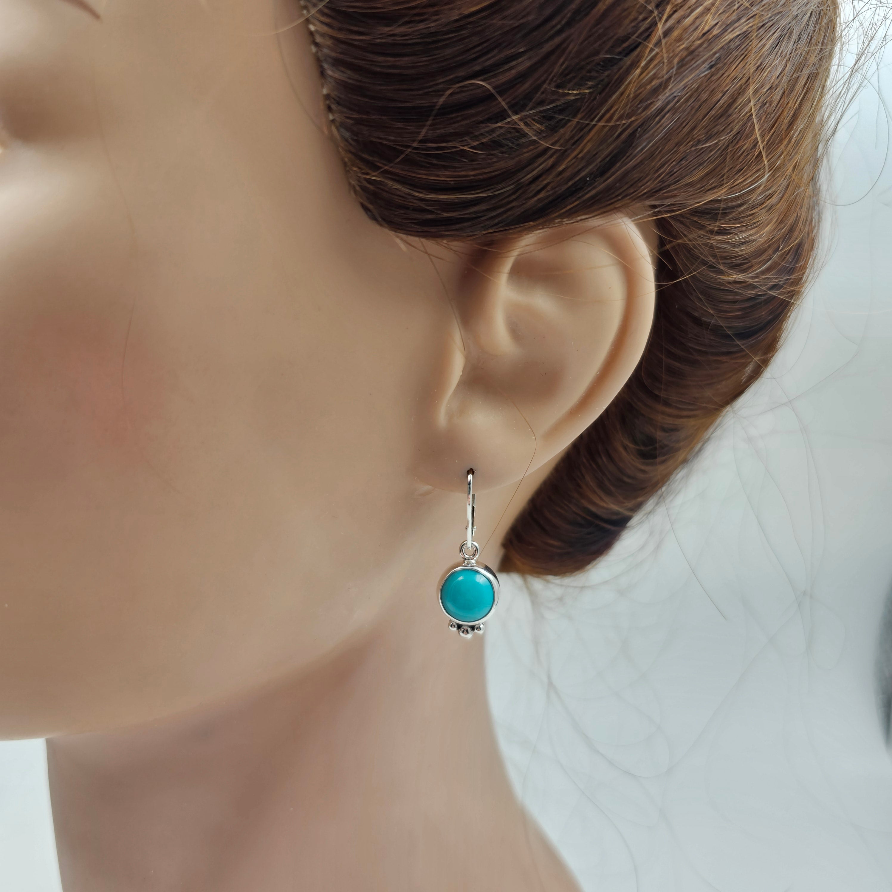 Round turquoise and sterling silver dangle earrings with silver beaded accents